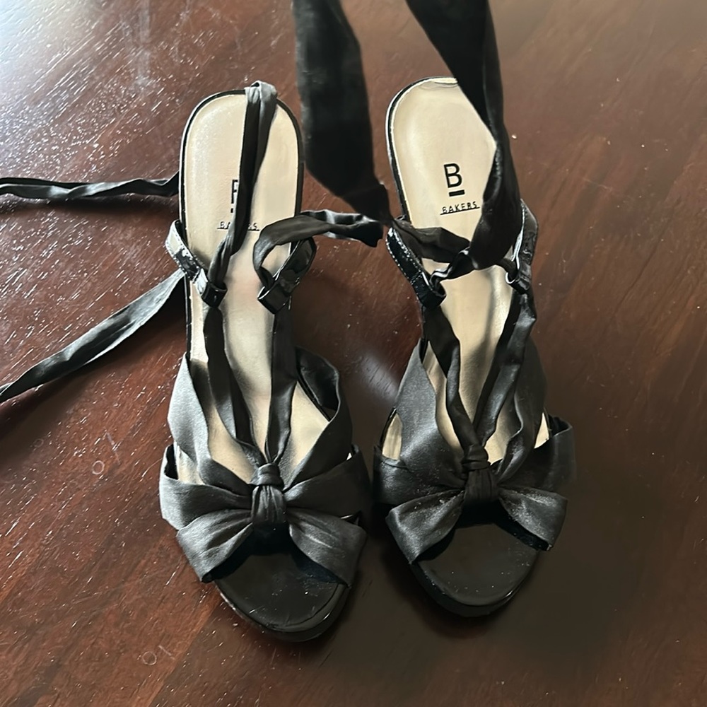 Cute satin material lace up wedges.   The wedge part is black patent leather.